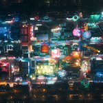 La Foire aux Plaisirs illuminée de nuit sur la place des Quinconces, vue aérienne en drone